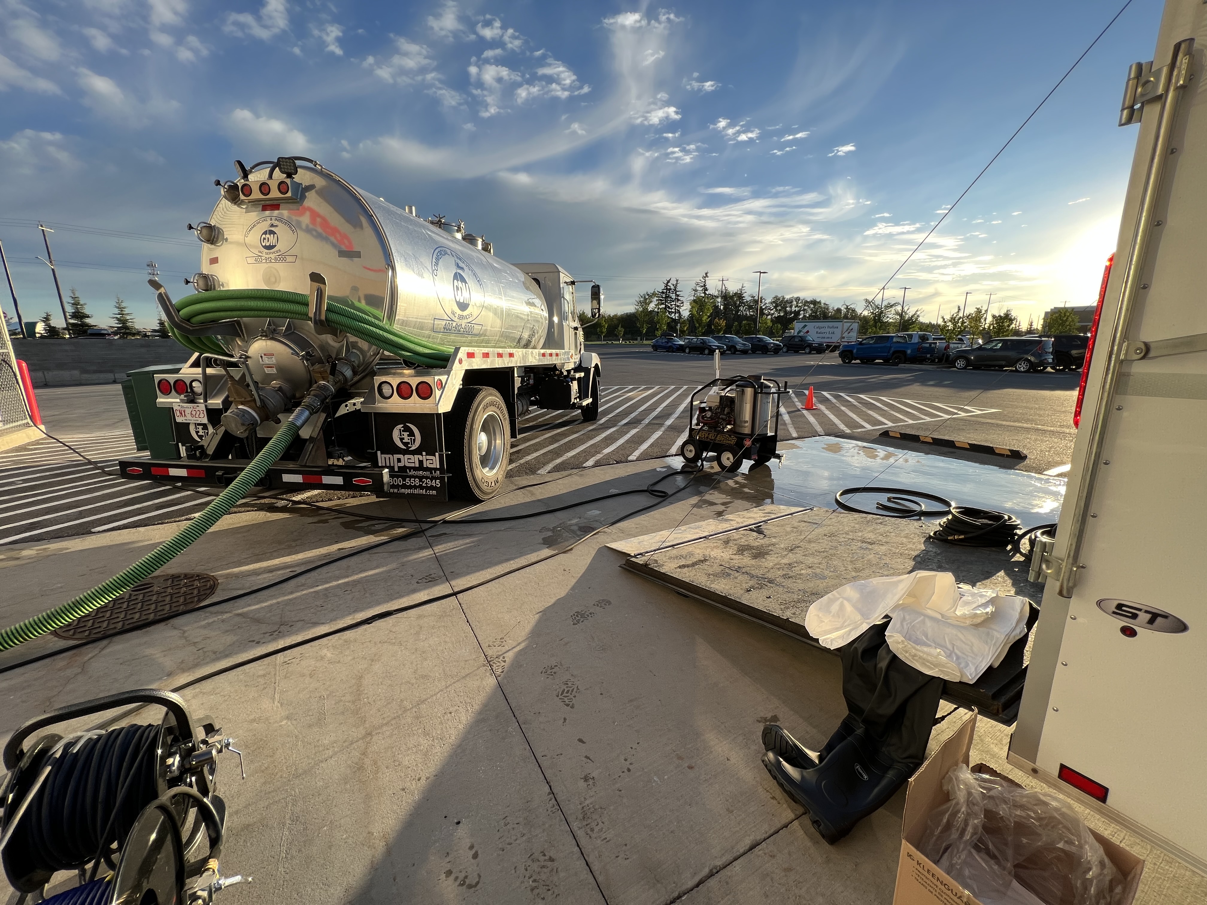 GDM Vac technicians opening an exterior grease trap